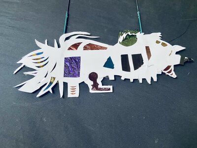 Children creating shadow puppets in workshop