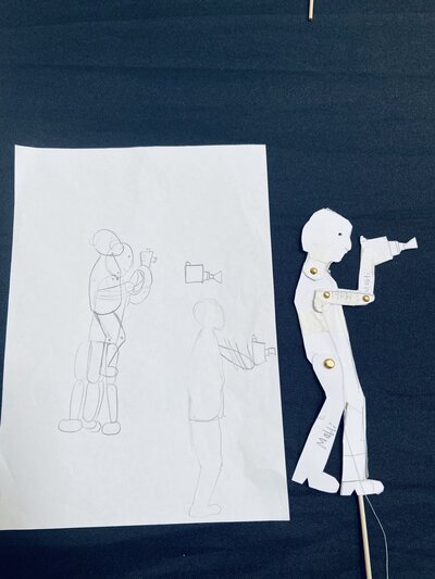 Children creating shadow puppets in workshop